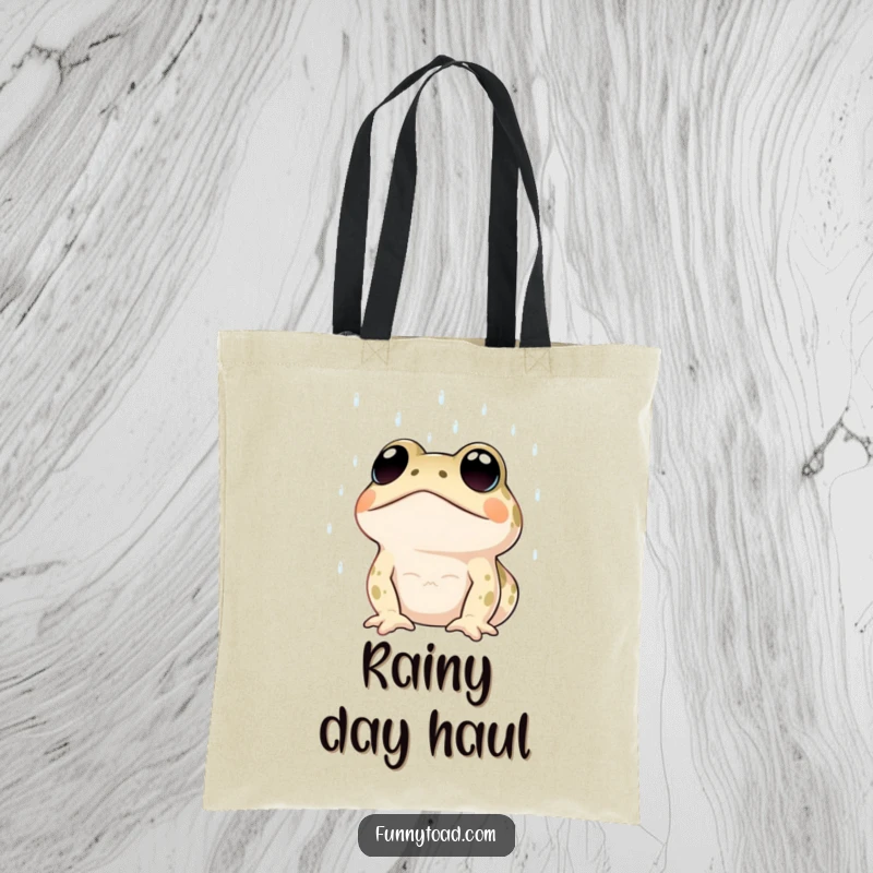Funny tote bag showcasing a toad with large, expressive dot eyes looking up at the rain. Humorous and practical.